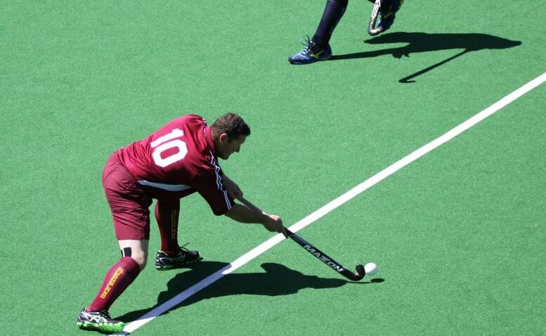 CONTROL: Bevan Green controls the ball playing for the Queensland team.