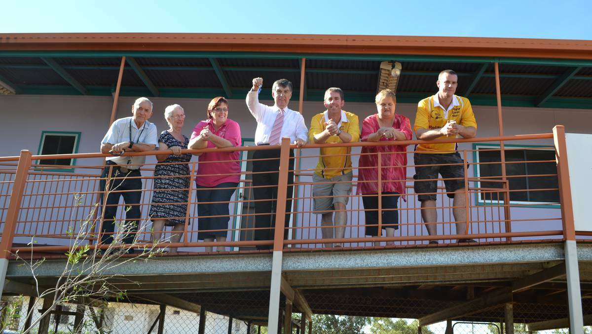 SPECIAL OPENING: Mount Isa City Mayor Tony McGrady hands the keys belonging to what was known as Purple House to representatives of three local cancer groups last year. Representatives are Les Bunn, Yvonne McCoy, Trish Goller, Cameron Gibson, Linda Lawrenson and Ben Macrae.