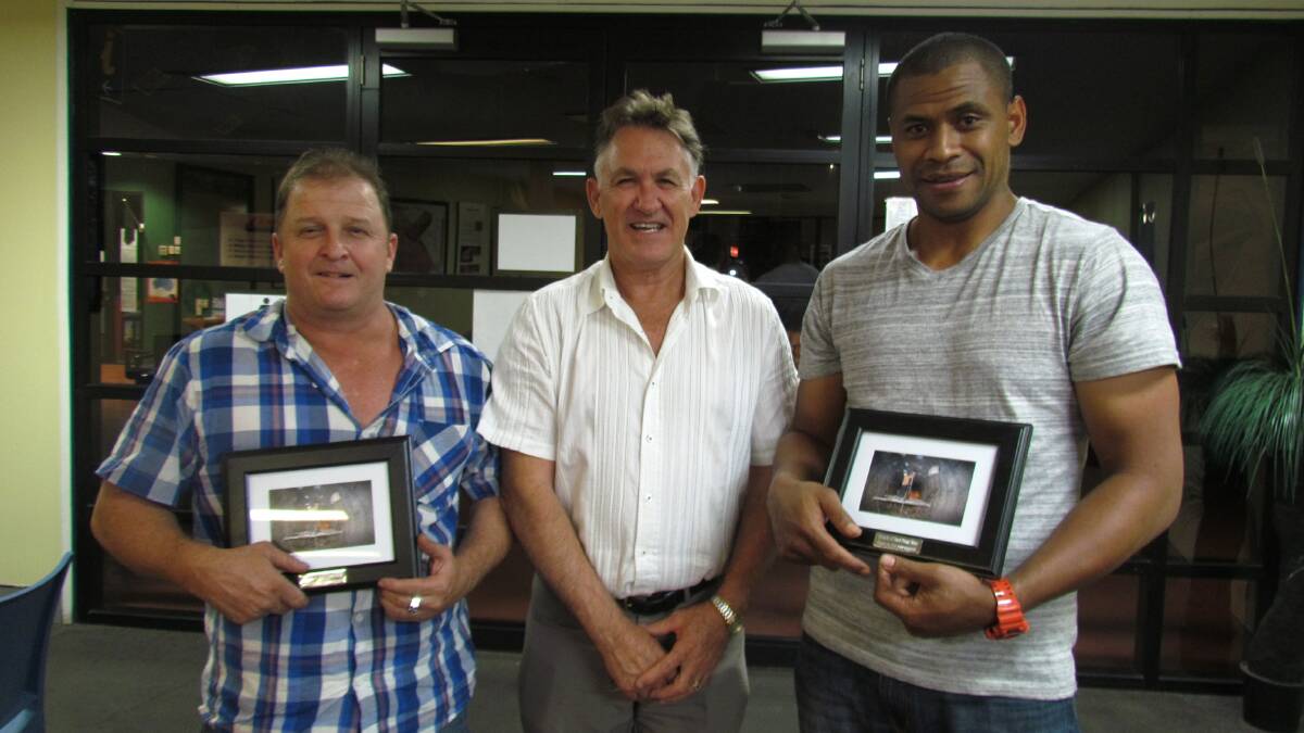 THANK YOU: MIETV chairman Phil Barwick presents Clint Brennan and Sonny Raitaba with a gift to acknowledge their hard work.
