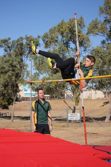  14-year-old Dan Butler clears 1.90m in pole vault.