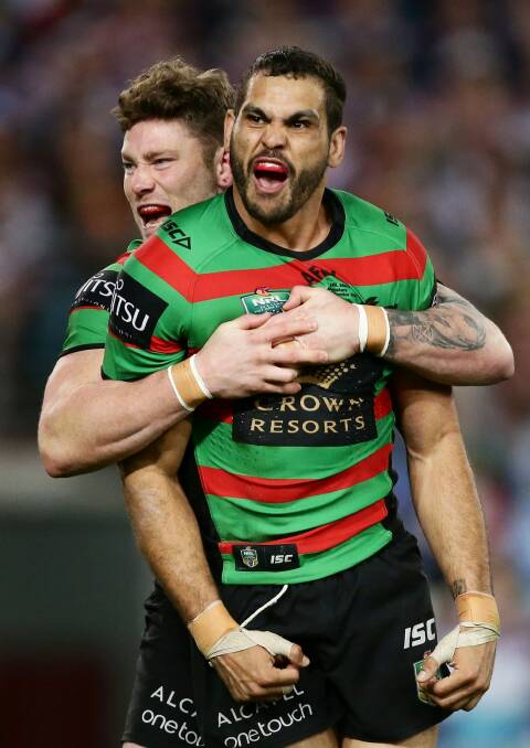 PUMPED: Greg Inglis celebrates with Chris McQueen after his second try during the first preliminary final against the Sydney Roosters last Friday.