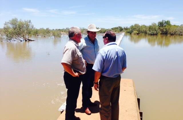 On tour: LNP candidate John Wharton (centre) with Doomadgee Shire CEO Rod Richardson and Infrastructure Manager Gary Jeffries inspecting the weir in the Nicholson River, which provides water   for Doomadgee. In November the left side of the weir was dry. 