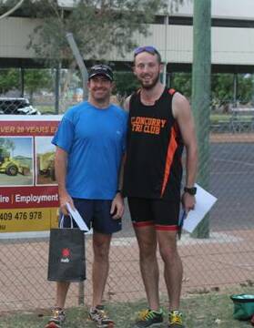 MEN’S CHAMP: Tony Cridland took out the first ever men’s mini triathlon in Cloncurry. He is pictured with Curry Cats president John Doody.