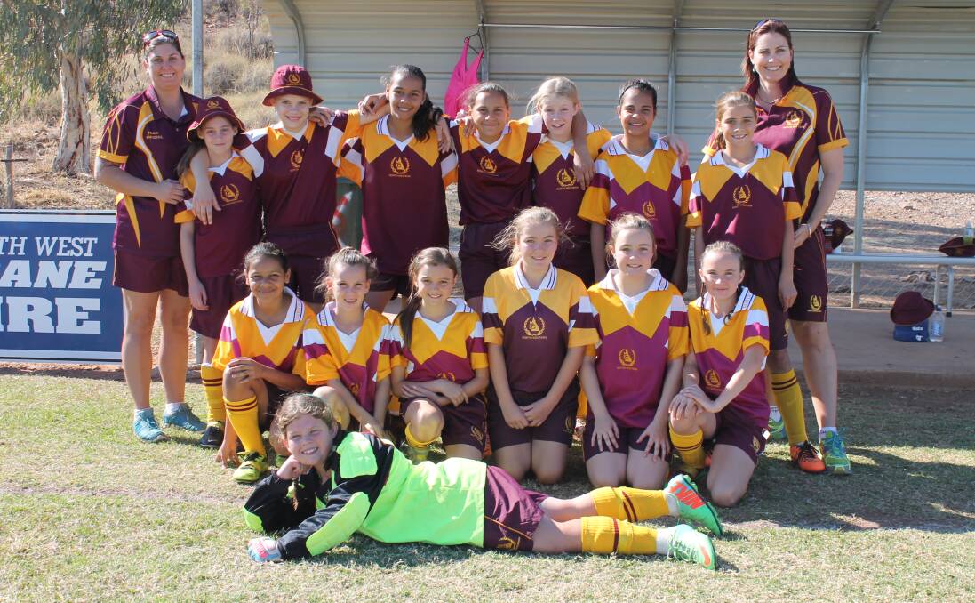 LOCAL GIRLS: The North West team posed for a fun photo before taking the field against their South Coast rivals. Pictured are (back row) Tierenny Millar, Annabelle Paterson, Antonia Connelly, Aaliyah Harrison,  Harper-Leigh Flay, Danielle Aplin, Allisa Sidnell, (front row) Jasmine Connelly, Holly Green, Abby Layt, Mikaela Staunton, Laine Avery, Brooke Salter and Jessica Knight. 
– Pictures: HAILEY RENAULT/8224 