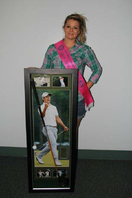 MEMORABILIA: Rodeo Queen Quest entrant Whitney Dickson with the signed Ada Scott golf club.