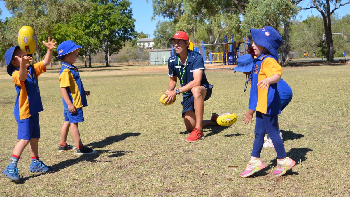 AFL Queensland Mount Isa Development Co-ordinator Finlay Blacklock has been running Auskick Centres in Mount Isa. Pictured is Barkly Highway State School students Darcy Toms, Daniel Rayner, Hayley Scrimgeour, and Sovana Tou-Foster.