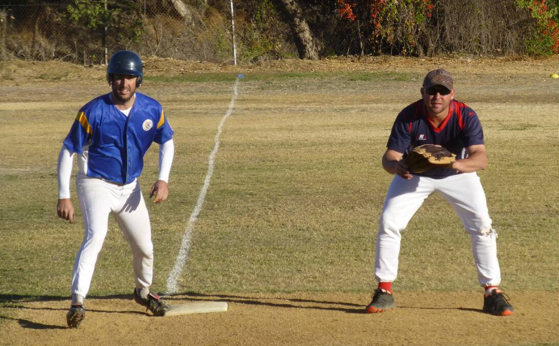 INCOMING: Chris Dredge (Wanderers) prepares to make his move on third base while Joe Stevens (Rebels) has it well covered. - Picture: DIANE CROGHAN