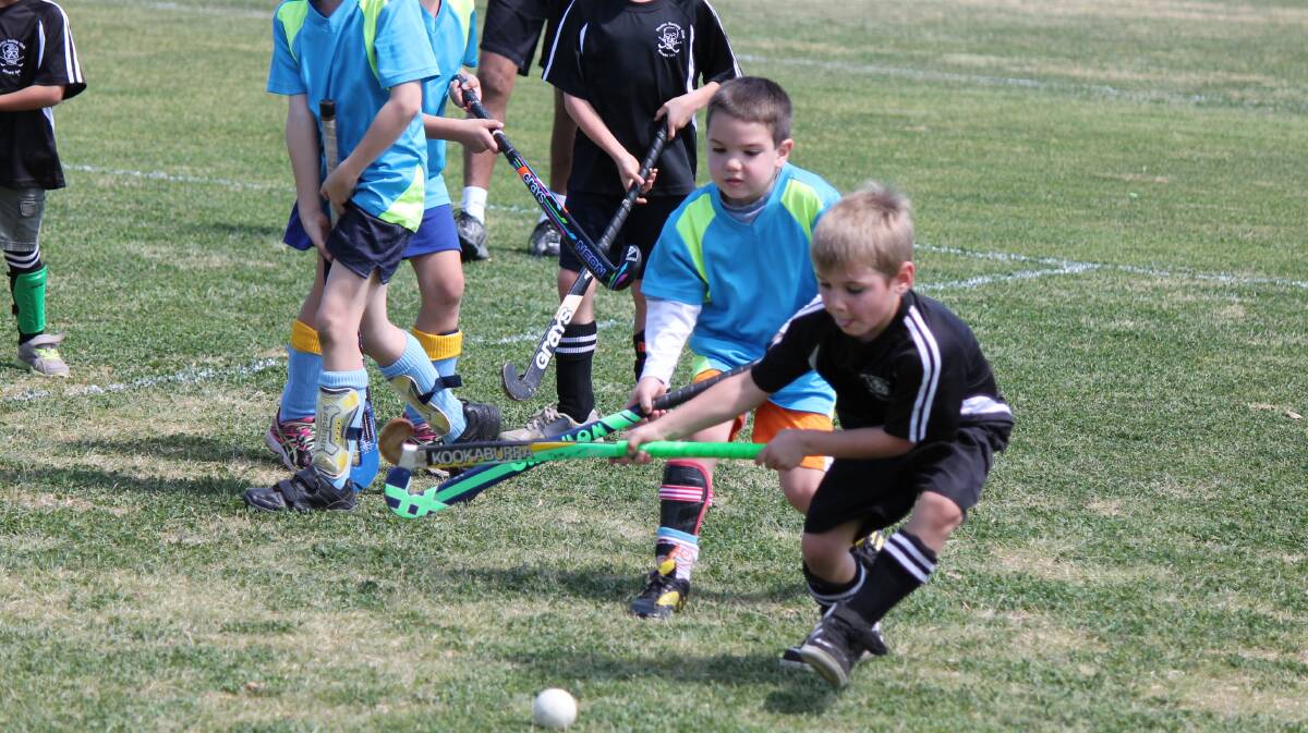  MY BALL: Pirates under 8s Deon McCarthy gets away from Aces opponent Nate Blythe.