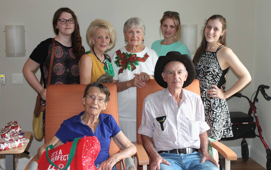 New residents Malcolm and Irene Cleary receive their gifts from Rebecca Shambrook, Sandra McGrady, Inez Bocos, Cheryn Crossland and Samantha Kollasch.