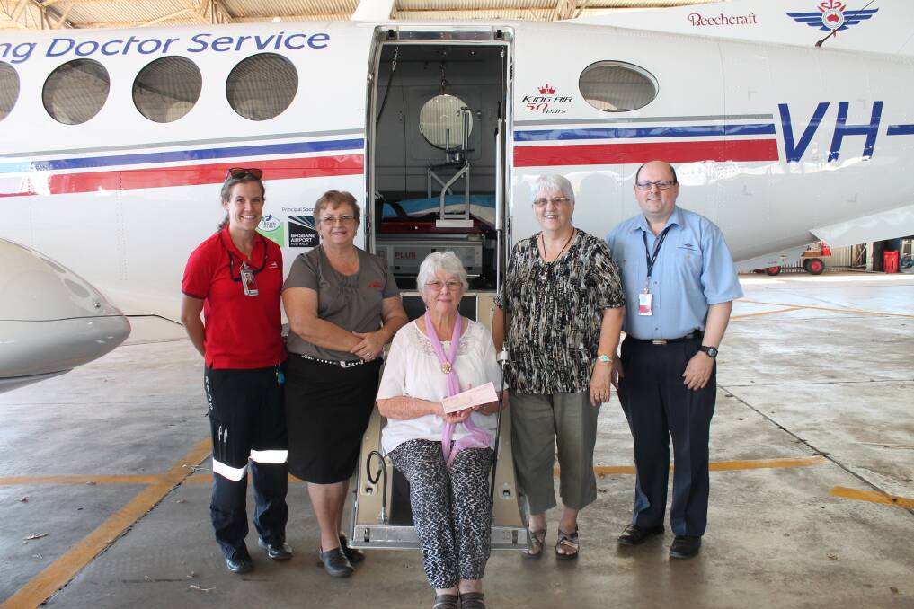 Isa Community Markets at the Overlander Hotel Committee members Sandra Cambetis, Jane Stevenson and Jane Drummand donated money raised to Royal Flying Doctors Service Mount Isa base. With RFDS base manager Alan Twells and flight nurse Michelle Ball. 