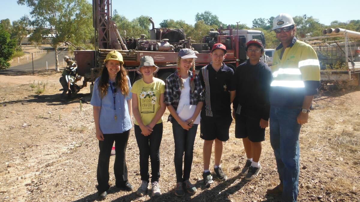 WATER: The school’s senior student support worker Dawn Doherty  with students Chloe McLean, Amy Cobden, Beau Corlis and Bon Las Doc with Kelly Drilling’s operations manager Jack Robertson.