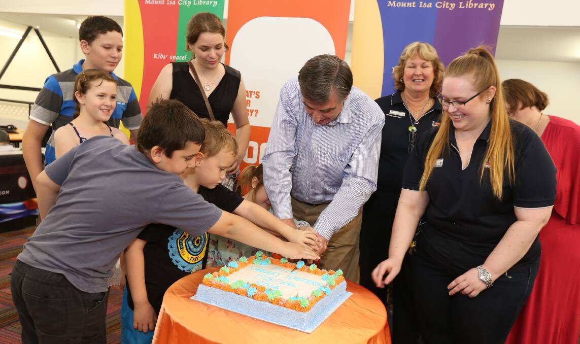 WRITERS FESTIVAL: Mayor Tony McGrady cuts the cake with guests, organisers and attendees. - Pictures: KATE GLOVER/ 8026