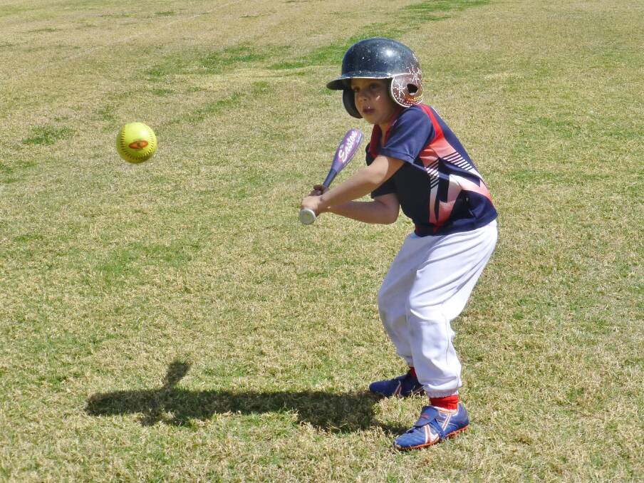 GUN: William Webber (Rebels T-Ball) is all ready to make contact with the ball.