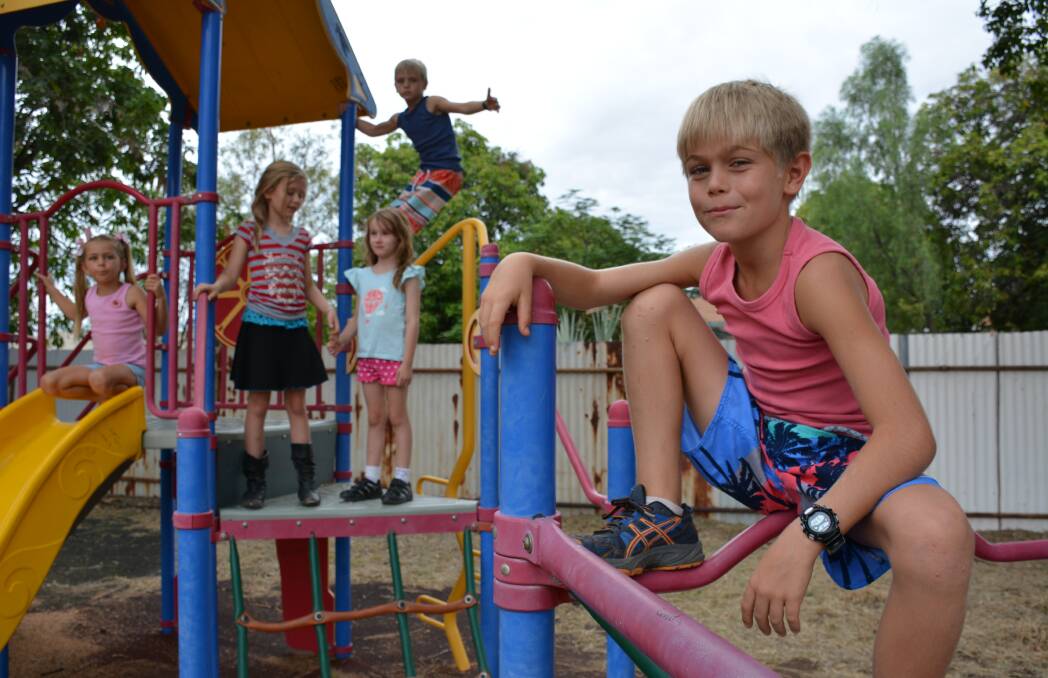 PLAY TIME: Cambel Hartley, 10, enjoying himself at Playway Park playground with Amelia Hartley, 5, Chace Pritchard, 6, Jasmin Pritchard, 8, and Mason Hartley, 8. The park needs better facilities and maintenance according to a mother who uses the park.