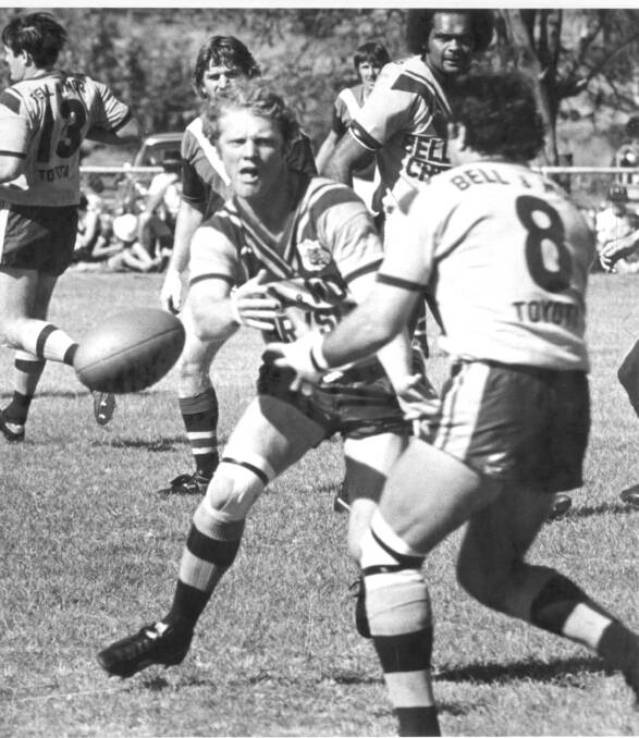 WINDING BACK THE CLOCK: Mount Isa’s Paul Laffin passes to Ron Slater, with Vern Daisy looking on. - Picture: MICHAEL CRUTCHER