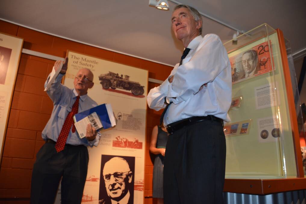 VIEWERS OF JOHN FLYNN’S LANTERN SLIDE SHOW: Former Deputy Prime Minister Tim Fischer and Friends of John Flynn president Don McDonald gaze looks at Flynn of the Inland’s slideshow – now an exhibit of the Cloncurry-based museum. 