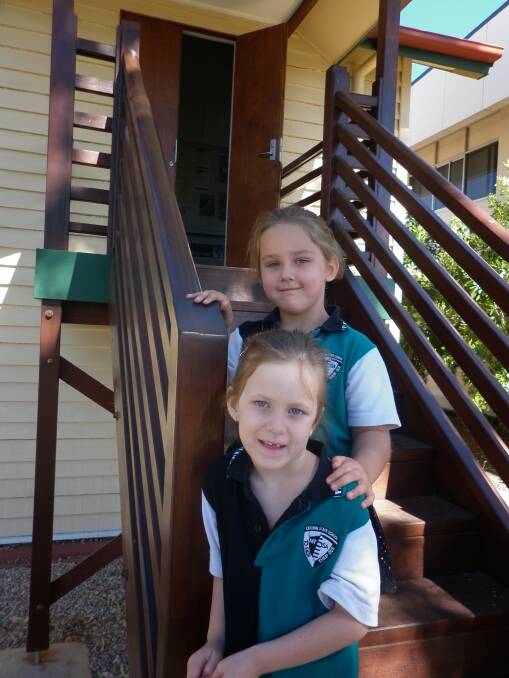 SCHOOL PRIDE:  Central State School students Willow Kerr and Shelbi Payne, both 5, get ready for the 90th year celebrations.