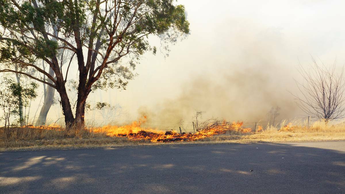 Firefighters battle a fire at Maiden Gully. Picture LUKE WALLIS (CONTRIBUTED)