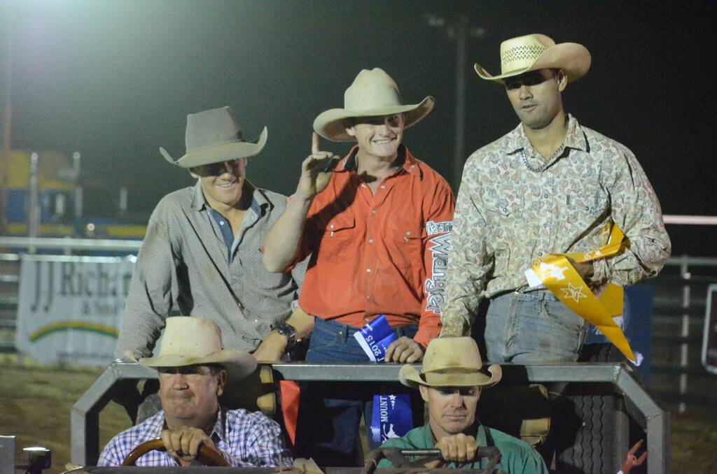 Mount Isa Campdraft Bull Ride placegetters Mitchell Lansdowne (2nd), Kyle Brummell (1st), and John Elliott (3rd) doing a celebration lap for the crowd. Picture: TOM ADAM
