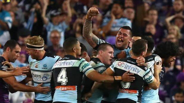 Magic moment: Andrew Fifita and the Sharks celebrate his match-winner in the grand final. Photo: Getty Images
