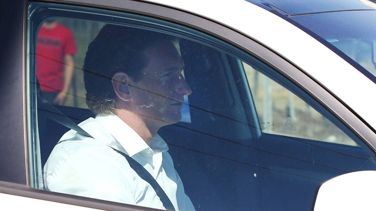 Bombers head coach James Hird drives into the Essendon Bombers headquarters after Essendon players were found not guilty from the AFL's anti-doping tribunal today from the investigation into alleged use of banned substances. Pic: Michael Dodge, Getty Images