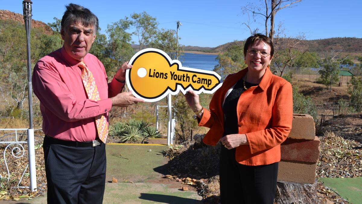 Handover: Mount Isa Mayor Tony McGrady and Mount Isa Water Board chairwoman Rowena McNally hold the “key” to the Lions Youth Camp when they inspect the site last August. 
