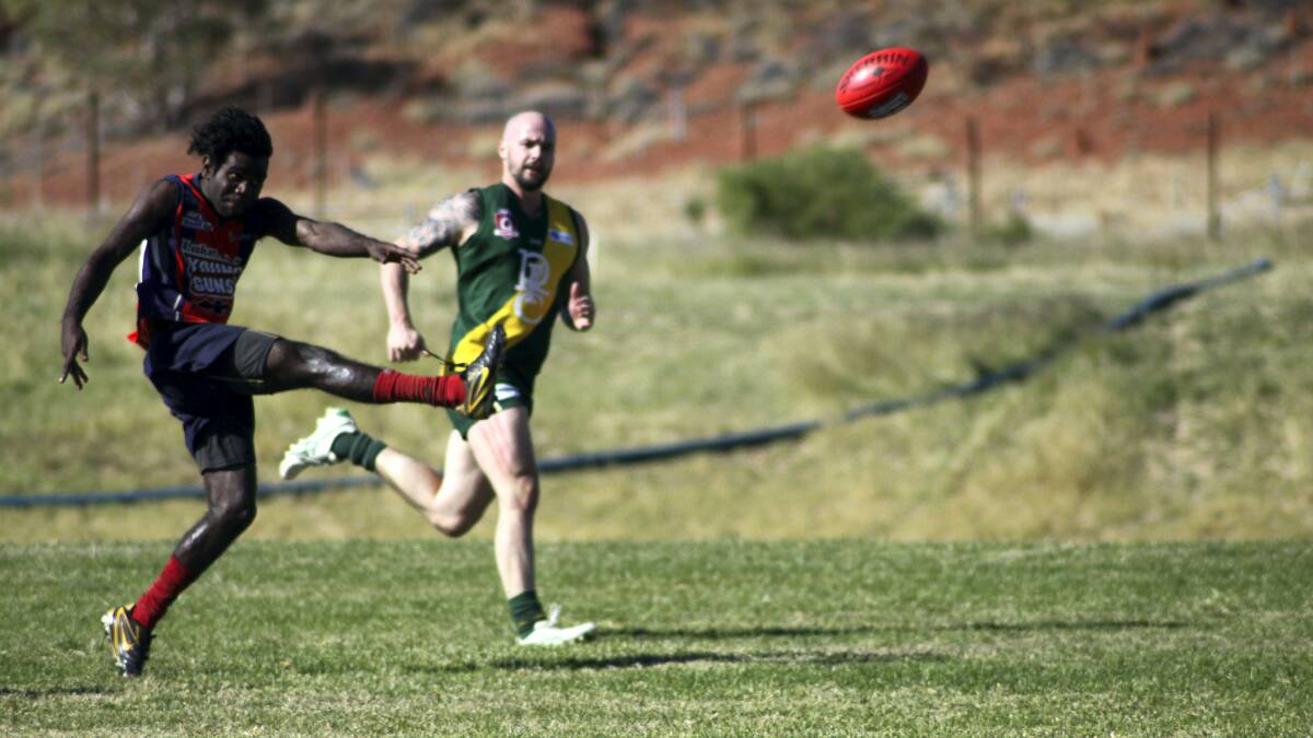 ON THE ATTACK:  Lake Nash Young Gun Troy Teague  gets his kick away despite pressure from Rovers' Levi Laurie.
