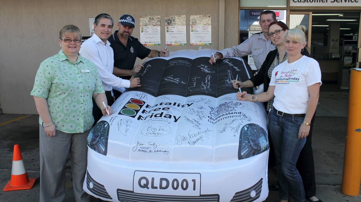  FATALITY FREE: Mount Isa road policing unit officer in charge Shaune English, state member for Mount Isa Rob Katter, Suncorp branch manager Machelle Kubler, Senior Transport Inspector Northern Ray Blain, Mount Isa Transport Services manager Cat White and road safety officer Danielle Gatehouse pen their pledge.

