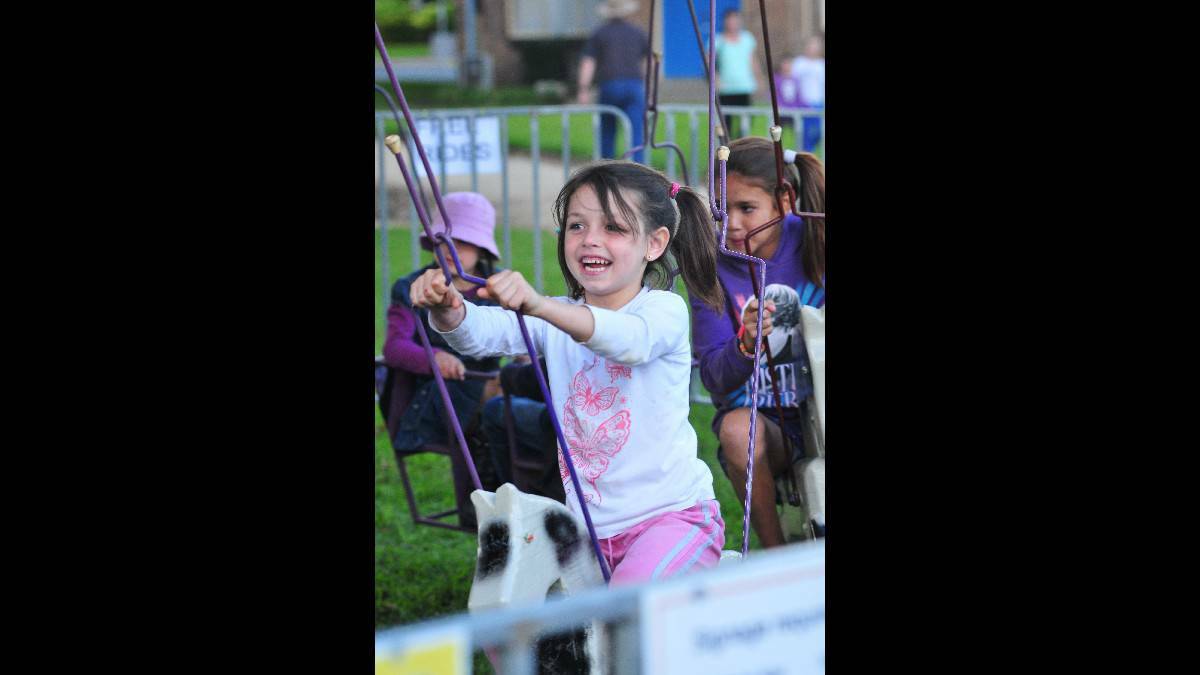 ORANGE: Tanayah Kelly holding on at Robertson Park on Sunday as families gathered for the Easter Family Festival. Photo: Jude Keogh/Central Western Daily.