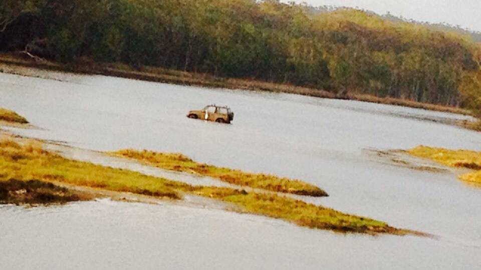 Ran out of road: The 4WD abandoned in Lake Cathie on Saturday.