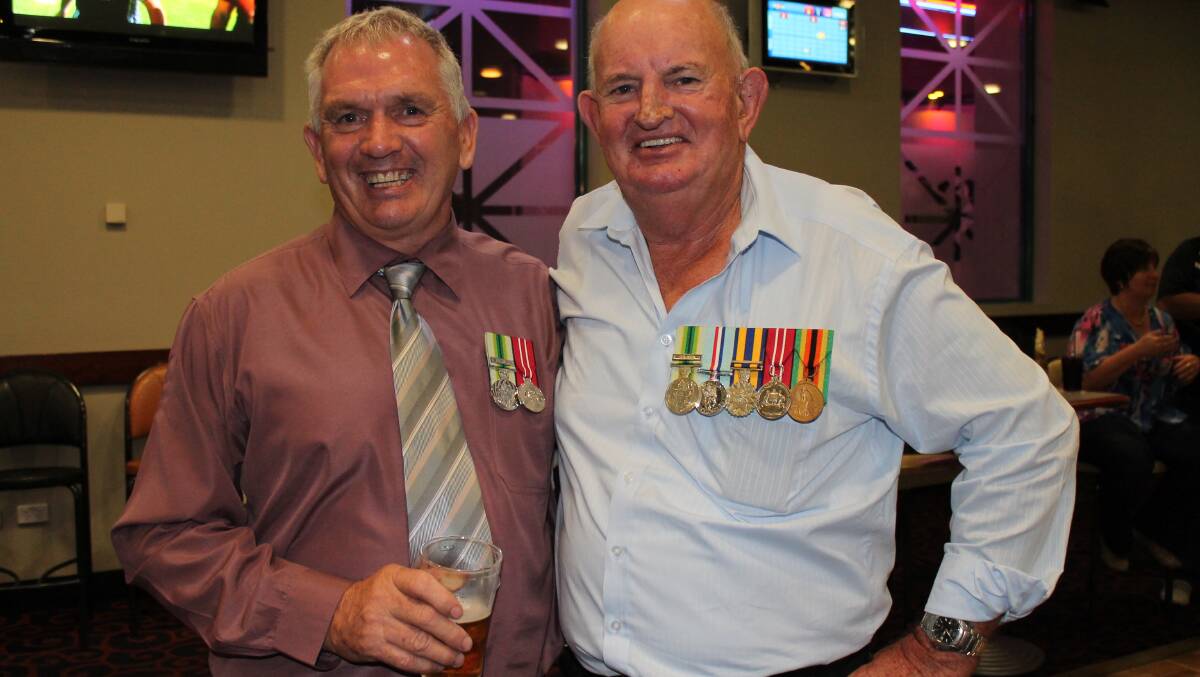 COMRADES: Eric Gillett and Warren Payne, from Brisbane, marched together for the first time in 30 years.