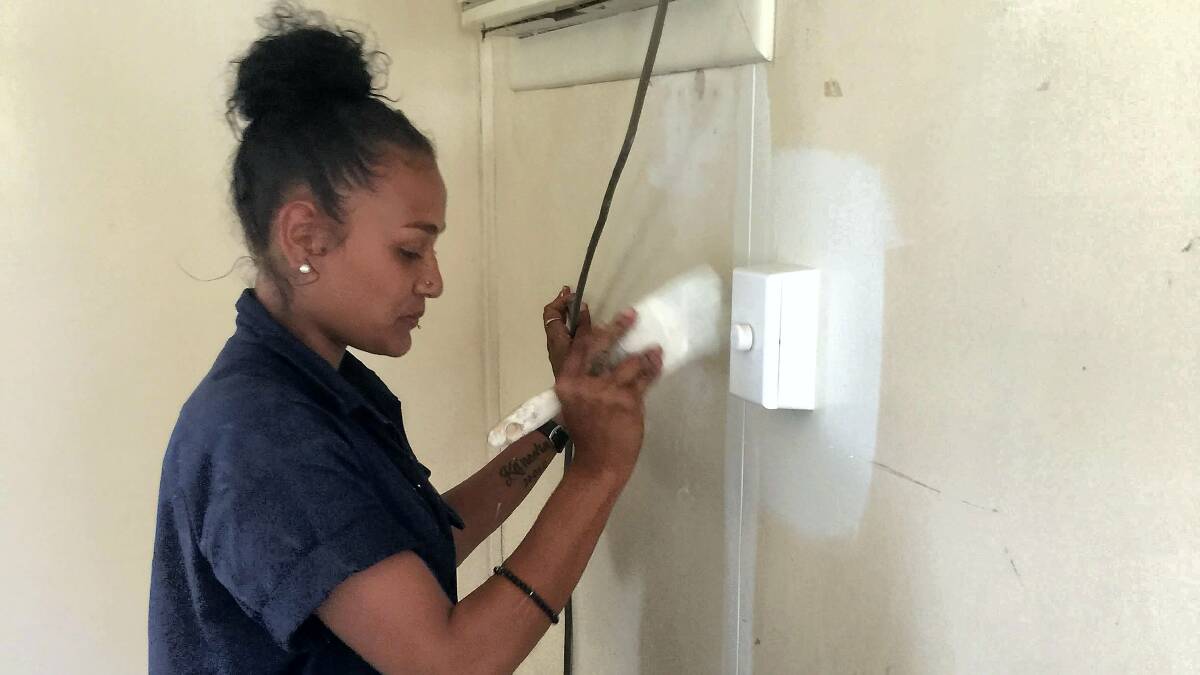 Mornington Island resident and enthusiastic painter Kathleen Juhel, 20, is benefiting from the joint venture to skill the community’s locals.