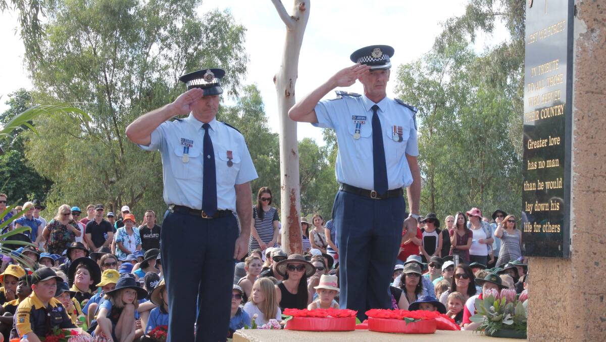 POLICE WREATH: Senior Sargeant Colin Henderson and Superintendant Russell Millar represent the Mount Isa Police at the Anzac Day ceremony.