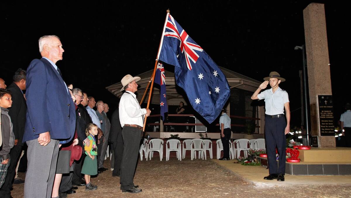AUSTRALIA FAIR: Cadet Corporal Marcus King salutes as the national anthem plays.