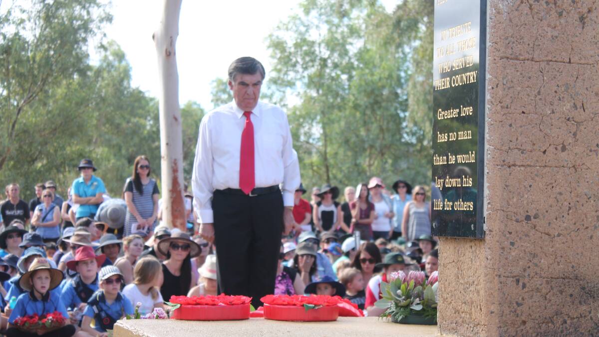 TRIBUTE: Mount Isa Mayor Tony McGrady honours the Anzac’s at George McCoy Park.
