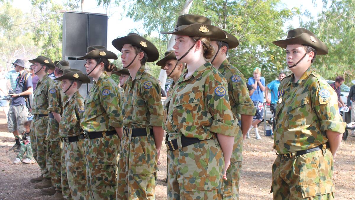 ATTENTION: The Mount Isa Army Cadets stand proud on Anzac Day at George McCoy Park.