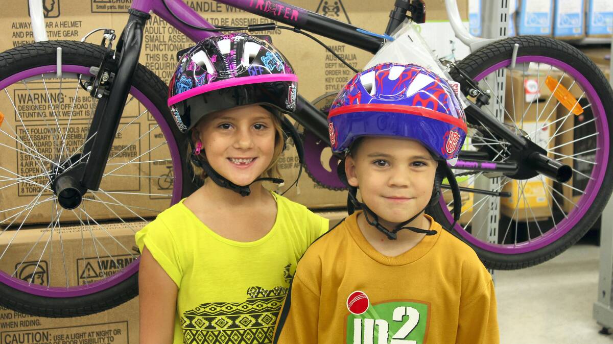 SAFETY FIRST: Erin and Riley Simpson shop at Kmart for safety gear for the holiday season.