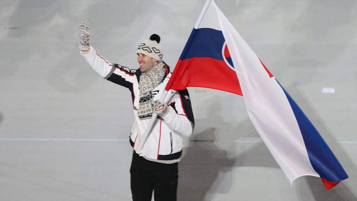 Ice hockey player Zdeno Chara of the Slovakia Olympic team carries his country's flag during the Opening Ceremony. Picture: Getty