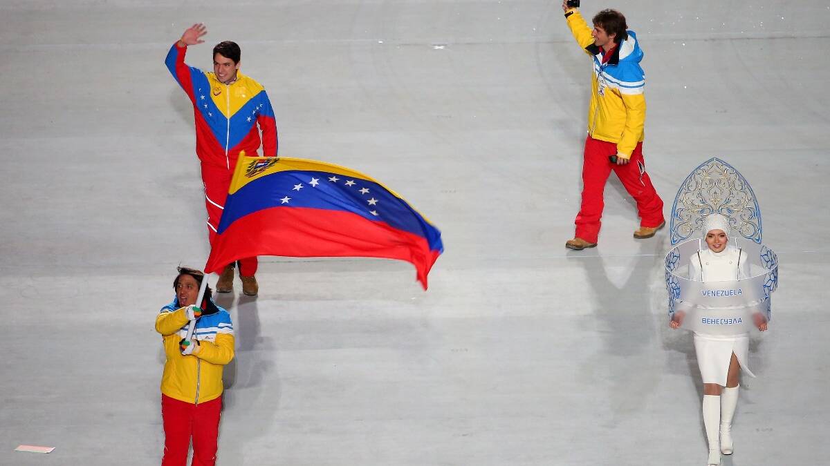 Skier Antonio Pardo of the Venezuela Olympic team carries his country's flag during the Opening Ceremony of the Sochi 2014 Winter Olympics. Picture: Getty
