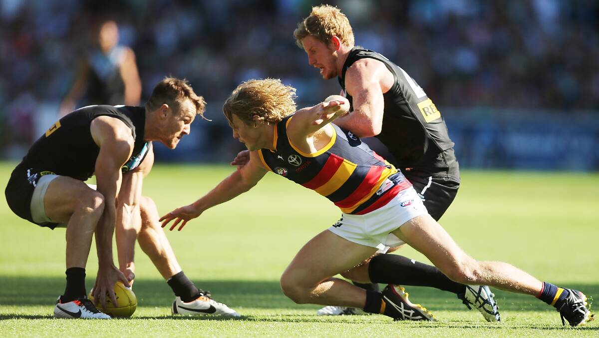 Rory Sloane of the Crows competes for the ball with Robbie Gray of the Power. Photos: Getty