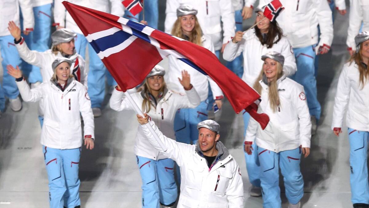 Skier Aksel Lund Svindal of the Norway Olympic team carries his country's flag during the Opening Ceremony of the Sochi 2014 Winter Olympics. Picture: Getty