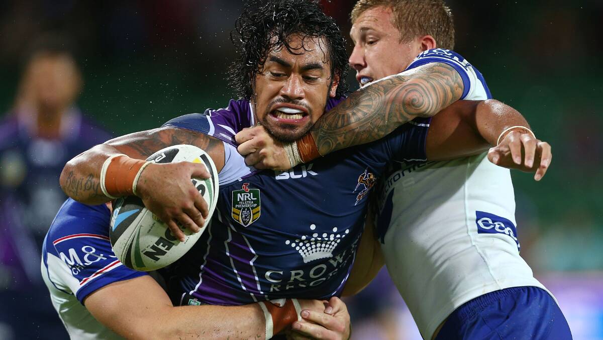 Mahe Fonua of the Storm is tackled by Josh Morris and Trent Hodkinson. Picture: Getty