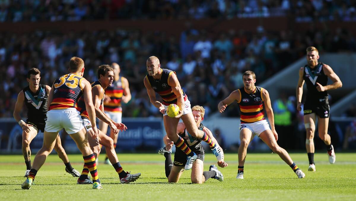 Scott Thompson of the Crows wins the ball during the round two AFL match between the Port Adelaide Power and the Adelaide Crows at Adelaide Oval. Photos: Getty