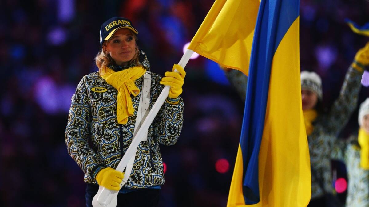 Valentina Shevchenko of the Ukraine Olympic team carries her country's flag during the Opening Ceremony of the Sochi 2014 Winter Olympics.. Picture: Getty
