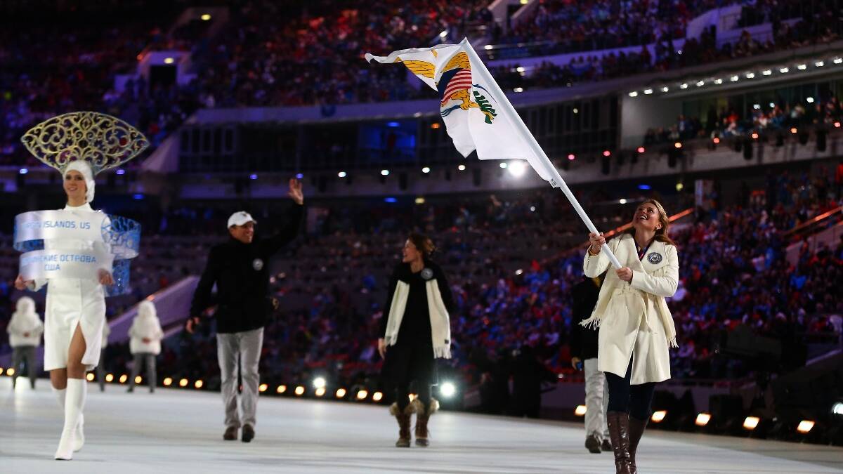 Skier Jasmine Campbell of the US Virgin Islands Olympic team carries her country's flag during the Opening Ceremony of the Sochi 2014 Winter Olympics. Picture: Getty