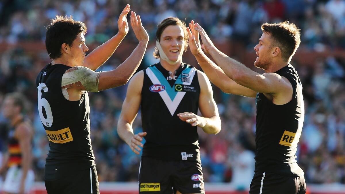  Angus Monfries, Jared Polec and Robbie Gray celebrate a goal. Photos: Getty