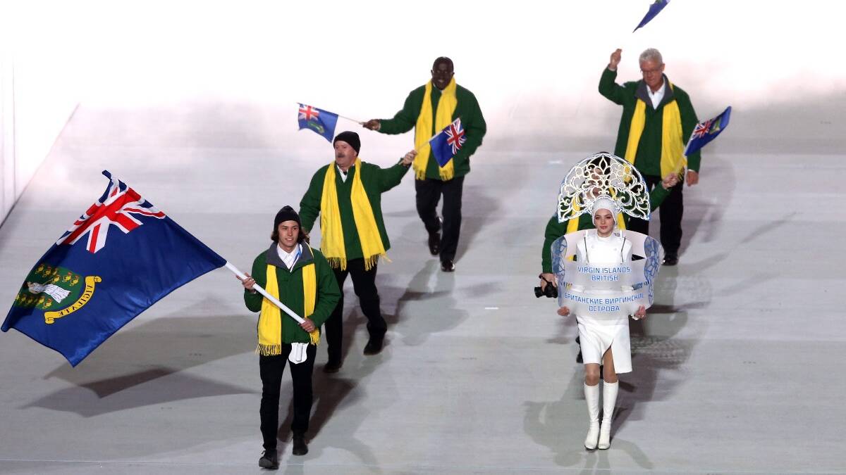 Peter Crooks of the British Virgin Islands Olympic team carries his country's flag during the Opening Ceremony of the Sochi 2014 Winter Olympics. Picture: Getty
