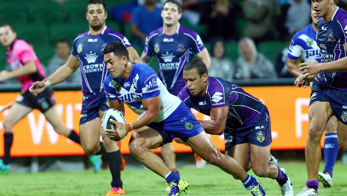Tim Lafai of the Bulldogs scores a try in the tackle of Will Chambers during the round four NRL match between the Canterbury-Bankstown Bulldogs and the Melbourne Storm. Picture: Getty