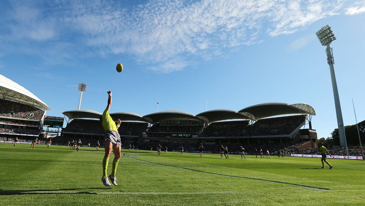 Round two AFL match between the Port Adelaide Power and the Adelaide Crows at Adelaide Oval on March 29. Photos: Getty
