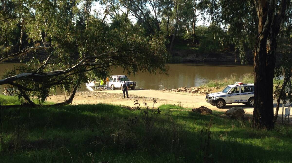 A Volunteer Rescue Association crew puts a boat into the Murrumbidgee River on Tuesday. Picture: Andrew Pearson